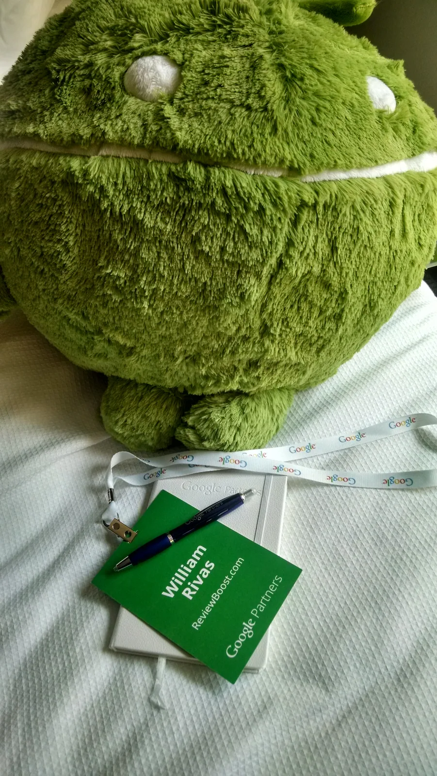 Android plush award beside William Rivas’s Google Partner badge