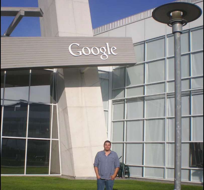 William outside a Google office building